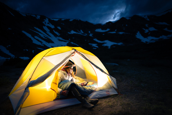 SPOT Gen4 Satellite GPS Messenger with girl in tent at night
