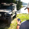 SPOT Gen4 Jeep Edition in guys hand with Jeep